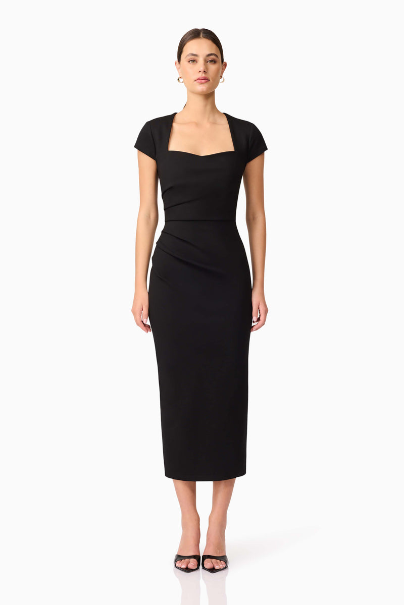 Brunette model wearing the Alina Fitted Midi Dress in Black front shot