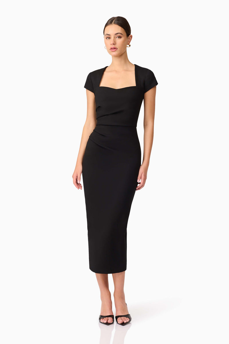 Brunette model wearing the Alina Fitted Midi Dress in Black posed shot