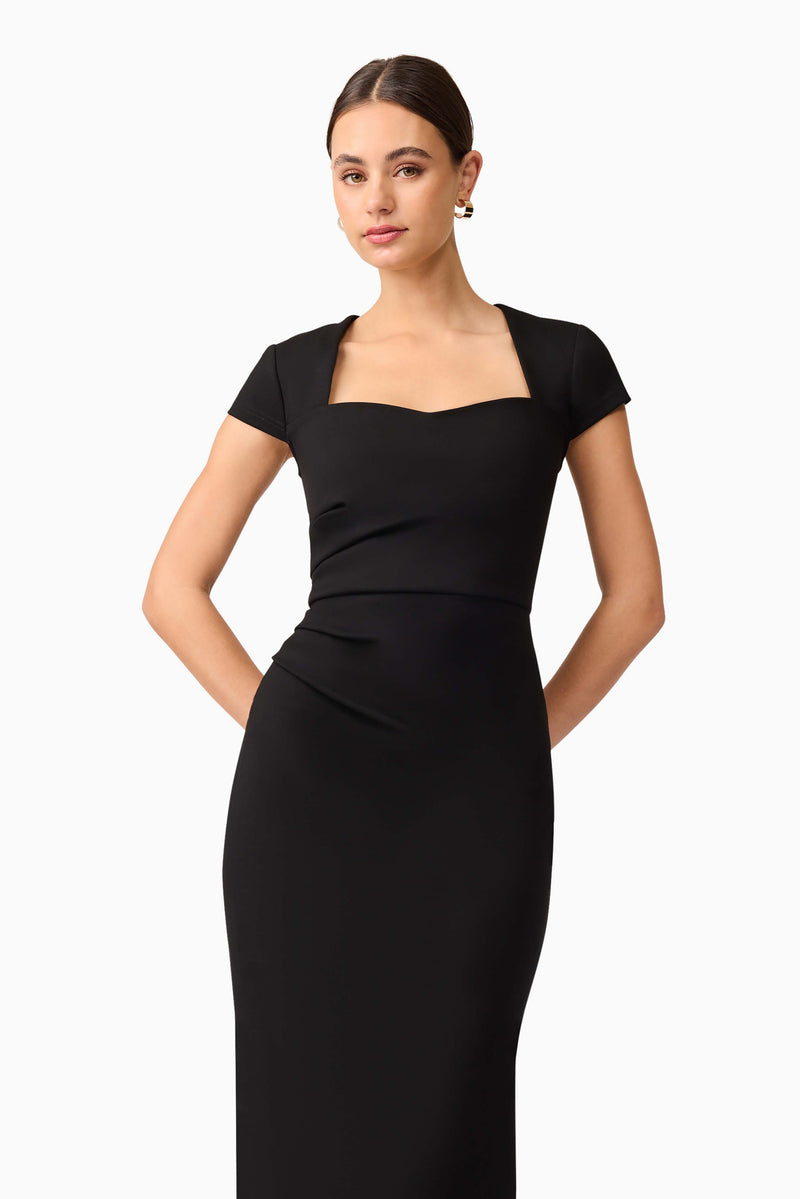 Brunette model wearing the Alina Fitted Midi Dress in close up shot