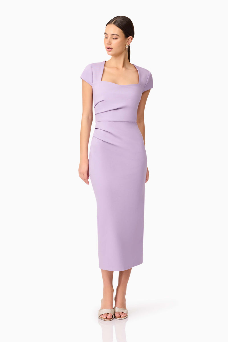 Brunette model wearing Alina Fitted Midi Dress in Purple posed looking away shot