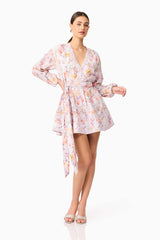 Brunette model wearing Ines Long Sleeve Mini Dress in Purple Floral posed shot