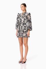 Brunette model wearing Jolie Long Sleeve Mini Dress in Black side shot