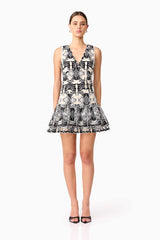 Brunette model wearing Jolie Floral Mini Dress in Black front shot