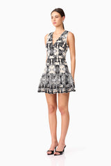 Brunette model wearing Jolie Floral Mini Dress in Black side shot