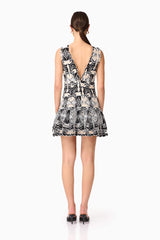 Brunette model wearing Jolie Floral Mini Dress in Black back shot