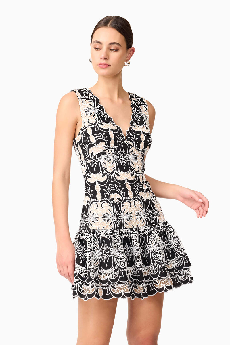 Brunette model wearing Jolie Floral Mini Dress in Black close up shot