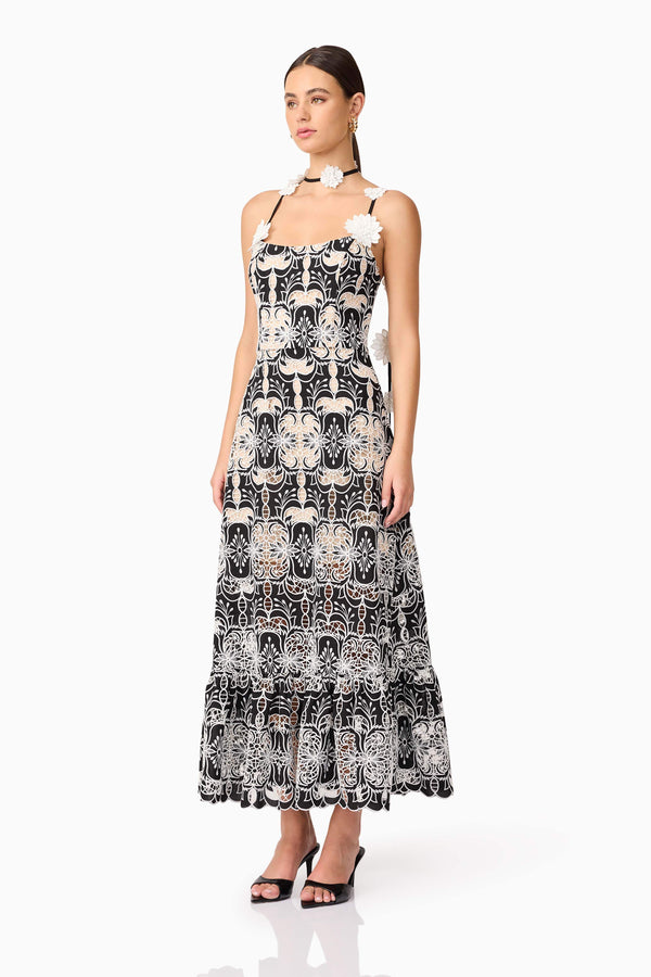 Brunette model wearing Jolie Floral Midi Dress in Black side shot