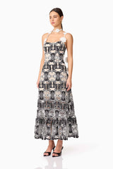 Brunette model wearing the Jolie Floral Midi Dress in Black side shot 