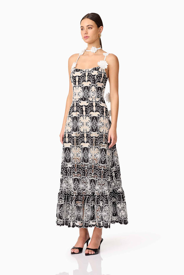 Brunette model wearing the Jolie Floral Midi Dress in Black side shot 