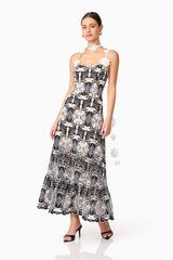 Brunette model wearing the Jolie Floral Midi Dress in Black posed shot 