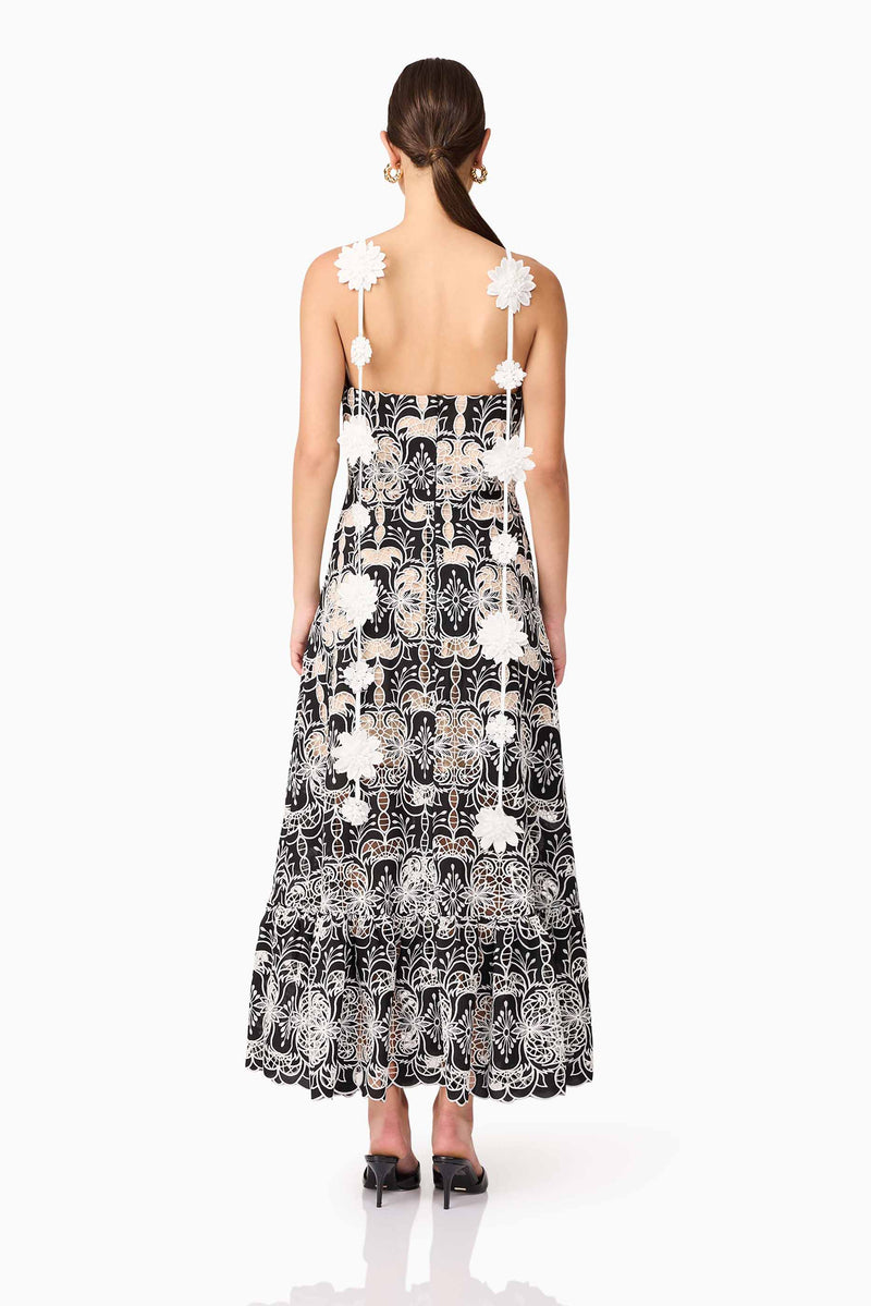 Brunette model wearing the Jolie Floral Midi Dress in Black back shot 