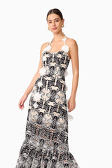 Brunette model wearing the Jolie Floral Midi Dress in Black close up shot 