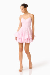 Fiorina Tiered Mini Dress in Pale Pink with lace  trim & v-neckline posed walking shot