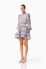 Rosaria Long Sleeve Mini Dress in Purple Floral with a high collar neckline side shot