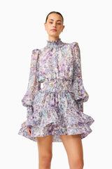 Rosaria Long Sleeve Mini Dress in Purple Floral with a high collar neckline close up shot