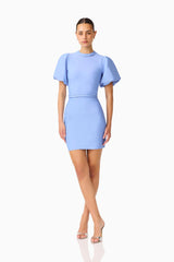 Floriana Puff Sleeve Mini Dress in Cornflower with high neckline & braided trim posed shot