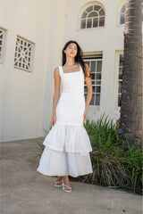 Brunette model wearing the Alexandra Tiered Gown in White content shot