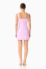 Brunette model wearing the Trompe 3D Mini Dress in Purple back shot 