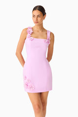 Brunette model wearing the Trompe 3D Mini Dress in Purple close up shot 