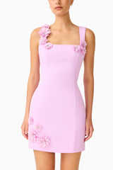 Brunette model wearing the Trompe 3D Mini Dress in Purple detail shot 