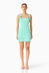 Brunette model wearing the Trompe 3D Mini Dress in Mint Green front shot 