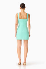 Brunette model wearing the Trompe 3D Mini Dress in Mint Green back shot 
