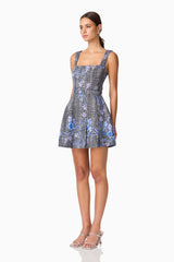 Brunette model wearing Allana Jacquard Mini Dress in Black & Blue Floral side shot