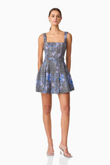 Brunette model wearing Allana Jacquard Mini Dress in Black & Blue Floral posed shot