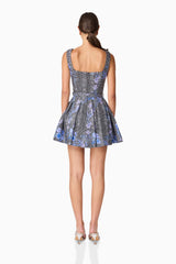 Brunette model wearing Allana Jacquard Mini Dress in Black & Blue Floral back shot