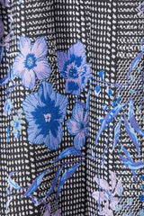 Brunette model wearing Allana Jacquard Mini Dress in Black & Blue Floral detail shot