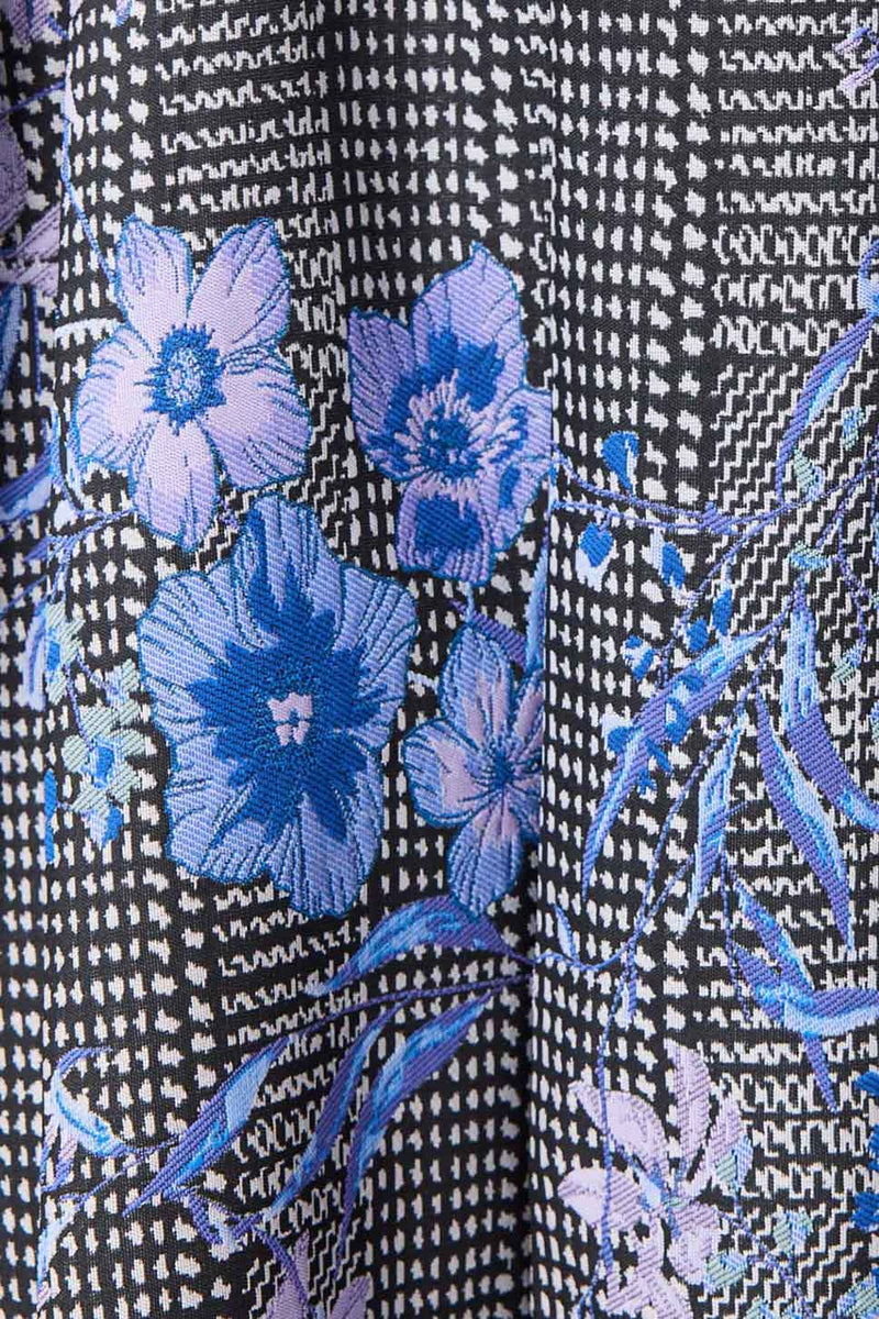 Brunette model wearing Allana Jacquard Mini Dress in Black & Blue Floral detail shot