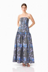 Brunette model wearing Allana Jacquard Strapless Gown in Black & Blue Floral posed shot 