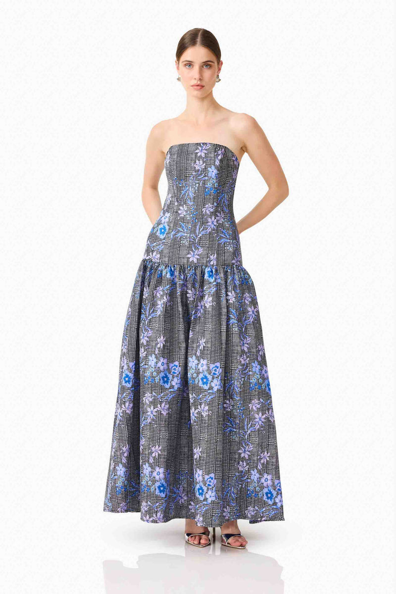 Brunette model wearing Allana Jacquard Strapless Gown in Black & Blue Floral posed shot 