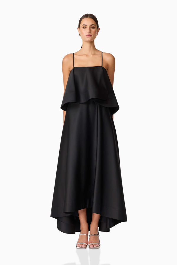 Brunette model wearing Reyna Tiered Maxi Dress in Black front shot