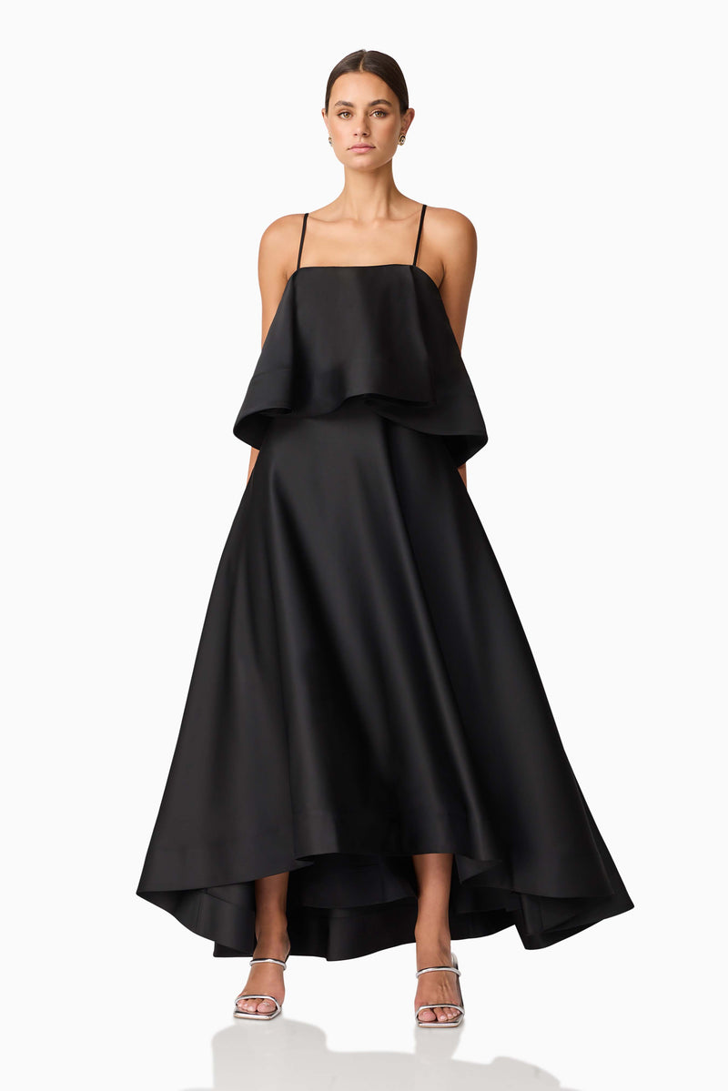 Brunette model wearing Reyna Tiered Maxi Dress in Black posed shot