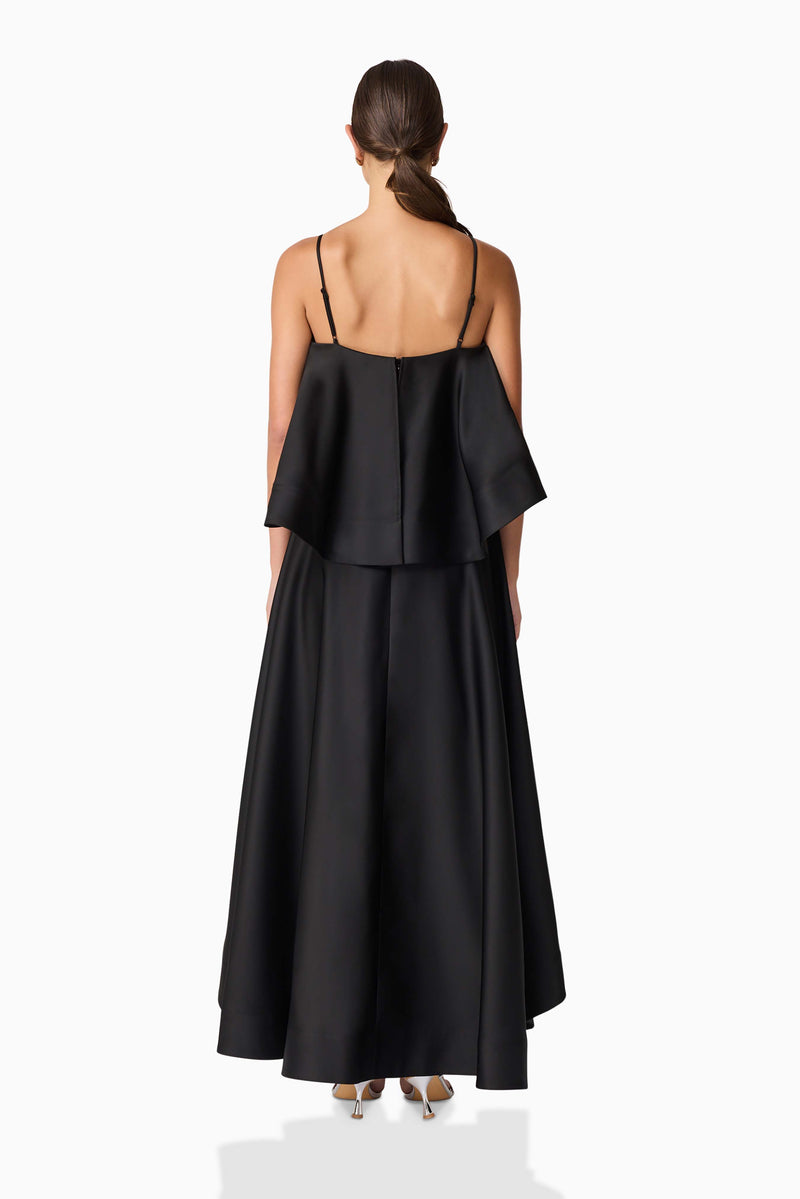 Brunette model wearing Reyna Tiered Maxi Dress in Black back shot
