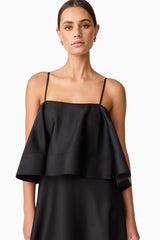 Brunette model wearing Reyna Tiered Maxi Dress in Black close up shot