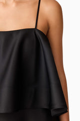 Brunette model wearing Reyna Tiered Maxi Dress in Black detail shot