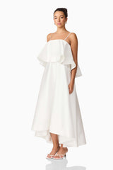 Brunette model wearing Reyna Tiered Maxi Dress in White side shot