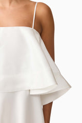 Brunette model wearing Reyna Tiered Maxi Dress in White detail shot