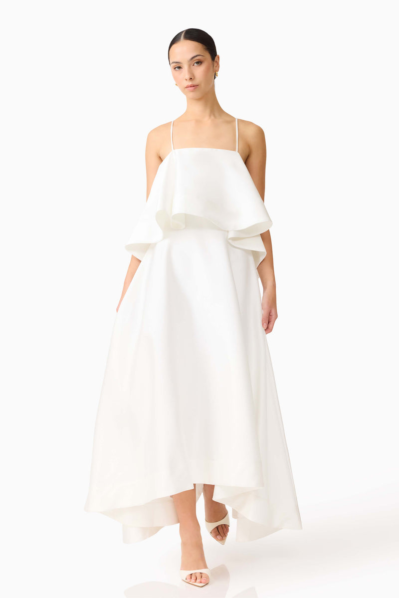 Brunette model wearing Reyna Tiered Maxi Dress in White posed shot
