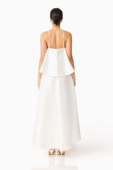 Brunette model wearing Reyna Tiered Maxi Dress in White back shot