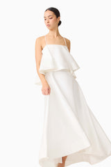 Brunette model wearing Reyna Tiered Maxi Dress in White close up posed shot