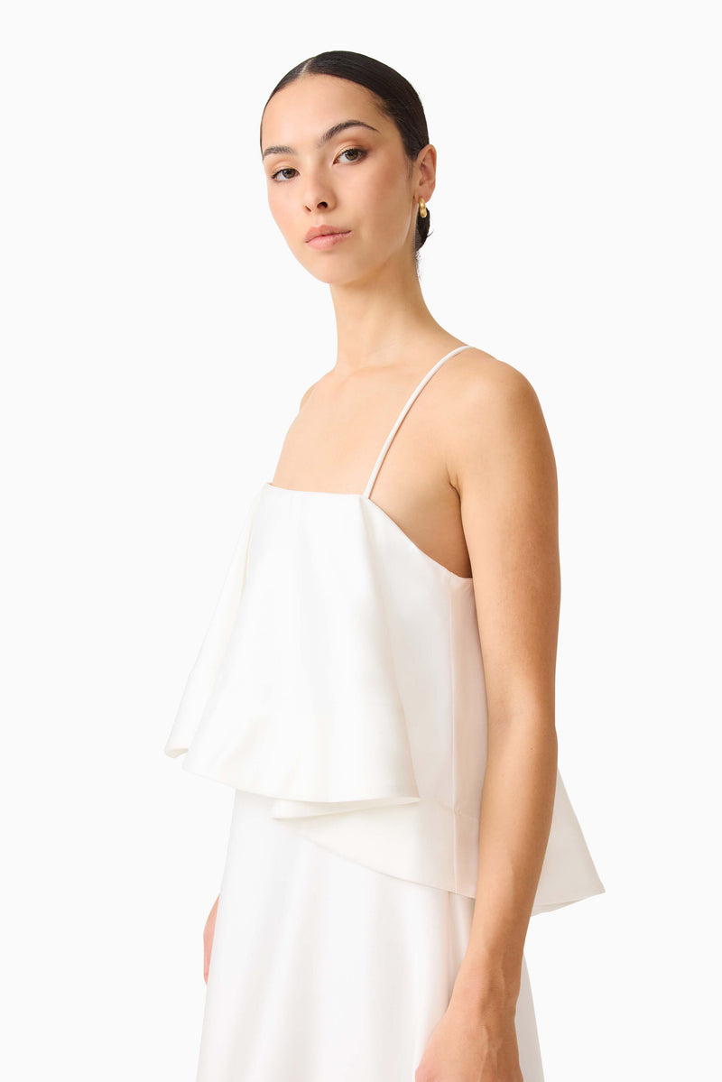 Brunette model wearing Reyna Tiered Maxi Dress in White close up shot