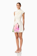 Brunette model wearing Azelie Asymmetrical Mini Dress in White side shot