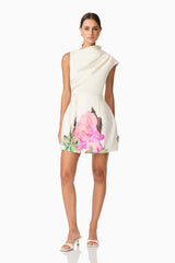 Brunette model wearing Azelie Asymmetrical Mini Dress in White posed shot