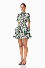 Brunette model wearing Rosey Short Sleeve Mini Dress in Black Floral side shot