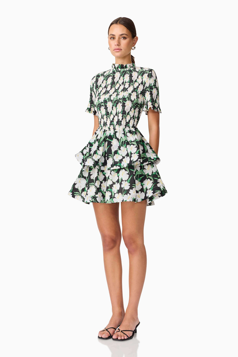 Brunette model wearing Rosey Short Sleeve Mini Dress in Black Floral side shot