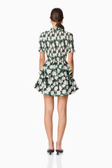 Brunette model wearing Rosey Short Sleeve Mini Dress in Black Floral back shot