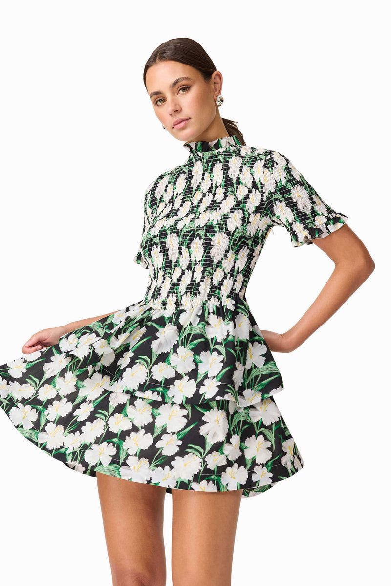 Brunette model wearing Rosey Short Sleeve Mini Dress in Black Floral close up shot